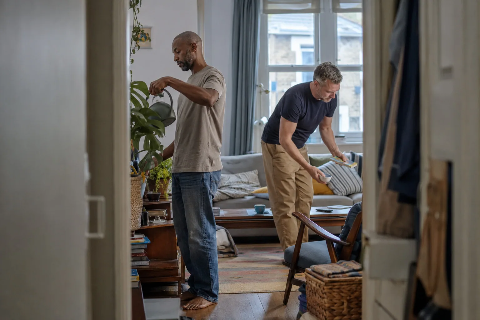 Two adults arranging their living room together