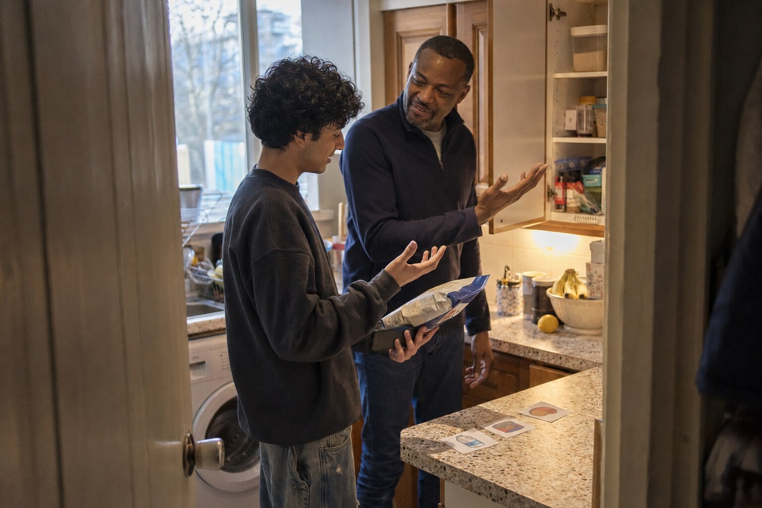 A foster carer having a warm, welcoming conversation at home
